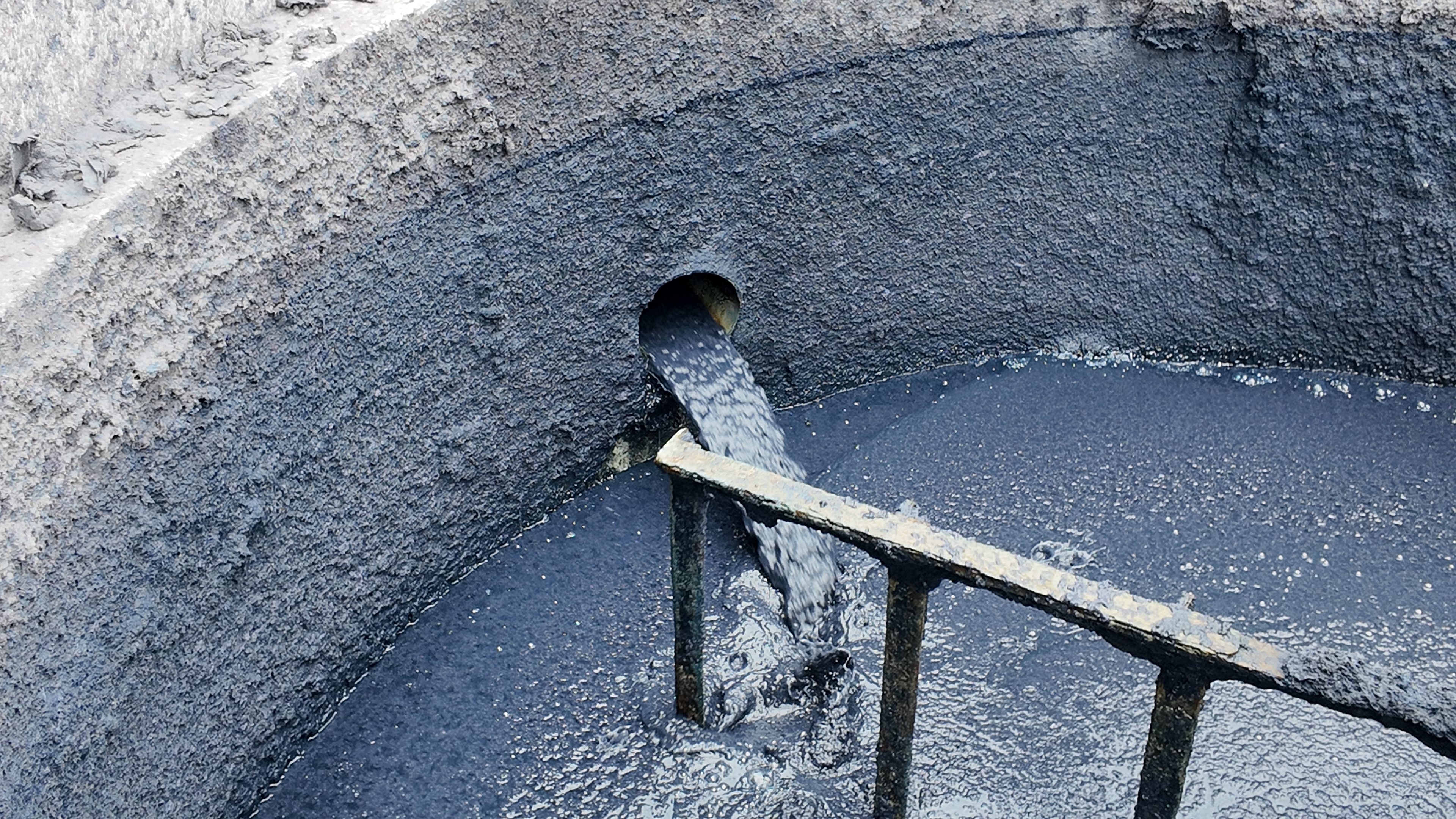 Pulp slurry flowing through a process tank at the facility.