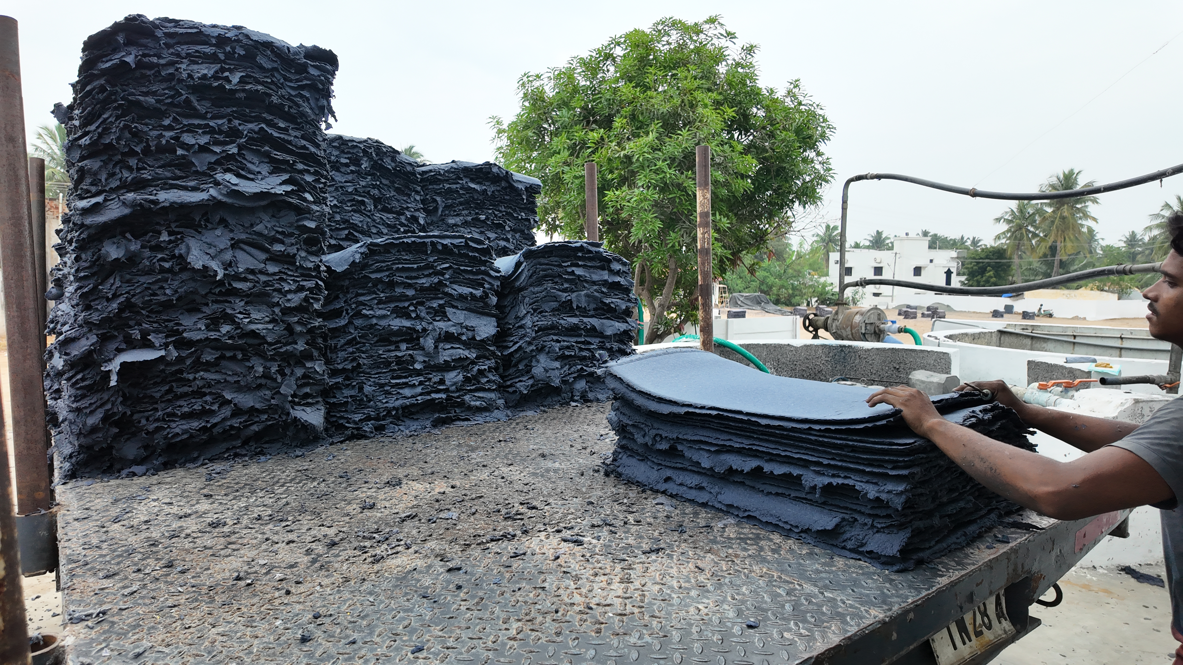 Stacks of finished product sheets ready for handling.